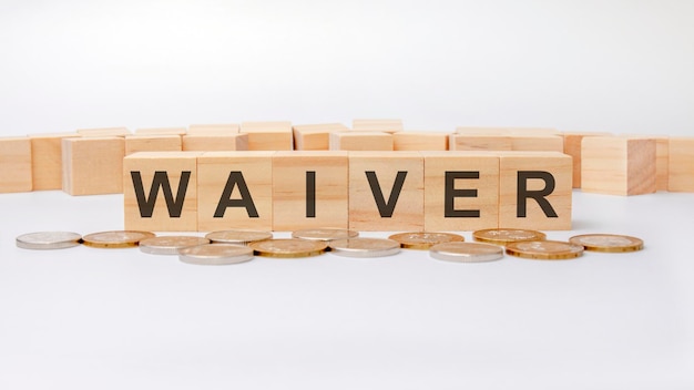 Waiver concept, wooden word block on grey background