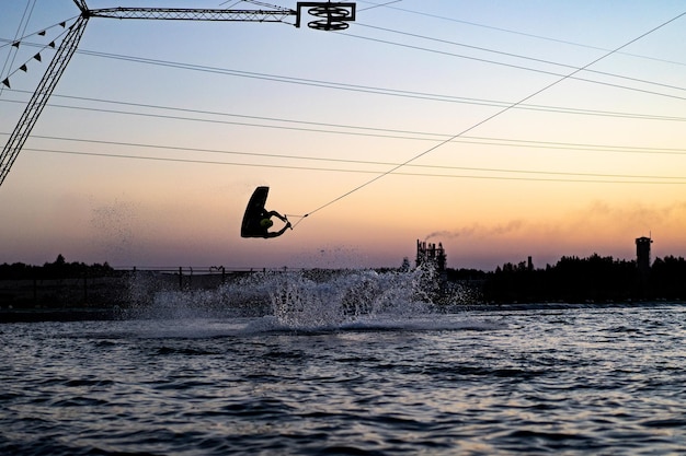 wakeboard. wakeboarding jumping at sunset