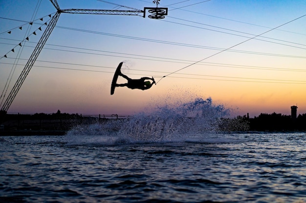 wakeboard. wakeboarding jumping at sunset