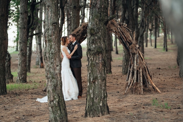 Walk of the bride and groom through the autumn forest in October