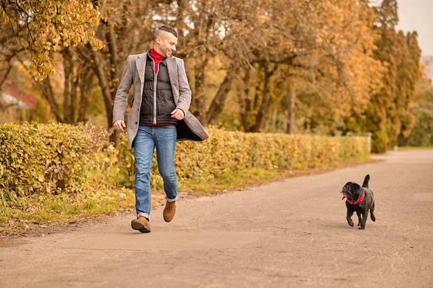 Photo walk. a man going for a walk with his dog