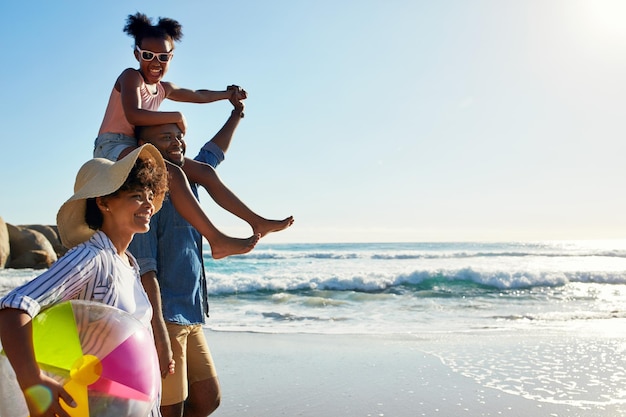 Walking beach and profile of relax black family travel happy and enjoy outdoor quality time together Ocean sea water blue sky mockup or freedom for bonding people on Jamaica holiday in summer