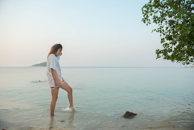 Walking on the beach in sunset time