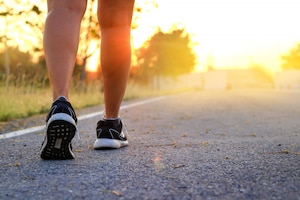 Walking exercise in the evening, seeing the orange light of the sun fresh air