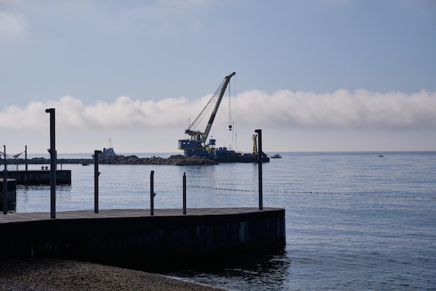 Walking on the shore of the Black Sea. Vacation at a recreation center near the seashore.