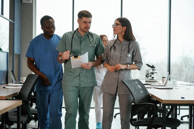 Walking together Group of doctors are indoors