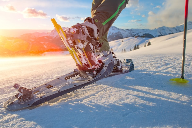 Walking with  snowshoes in mountains