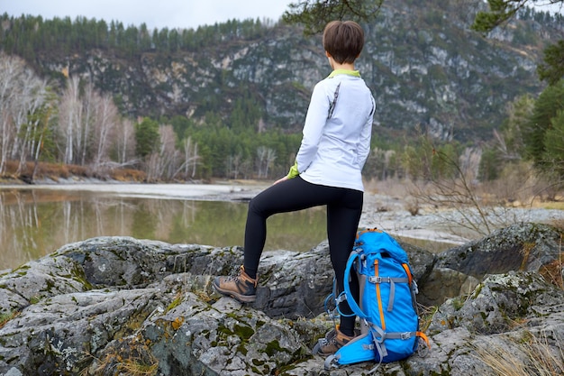 Walking woman travels with a backpack