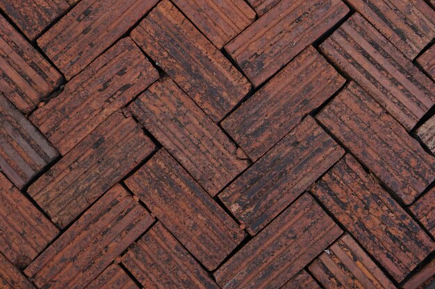 walkway is paved with brown bricks.