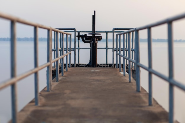 The walkway opens and closes the dam's water gate