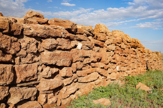 Wall of ancient building selective focus on old ruined wall of an antique building