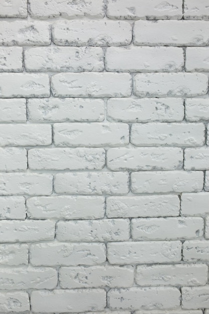 벽 배경입니다. 배경 텍스처입니다. 질감 벽돌이 있는 벽. 벽에 다이아몬드. 흰 벽