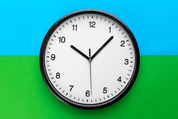 wall clock on color background