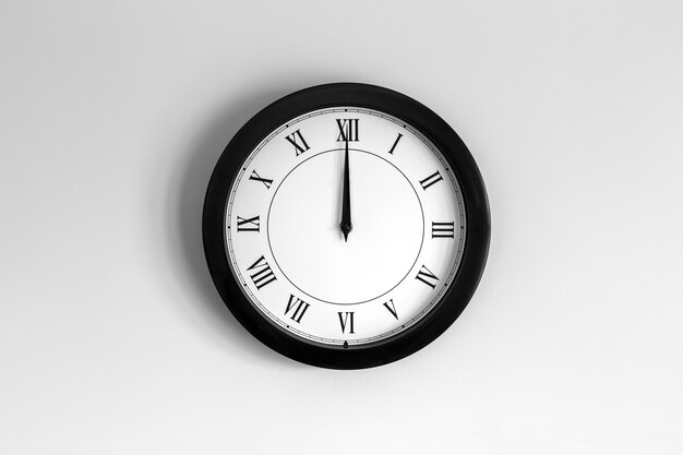 Photo wall clock roman dial showing twelve o'clock