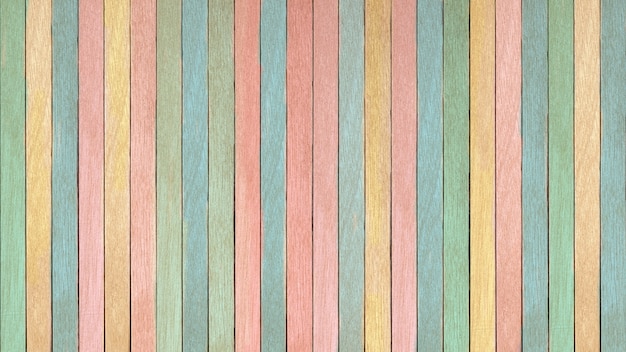 Wall composed of multi-colored wooden boards texture background