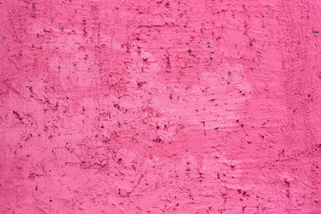 Photo wall covered with decorative pink plaster
