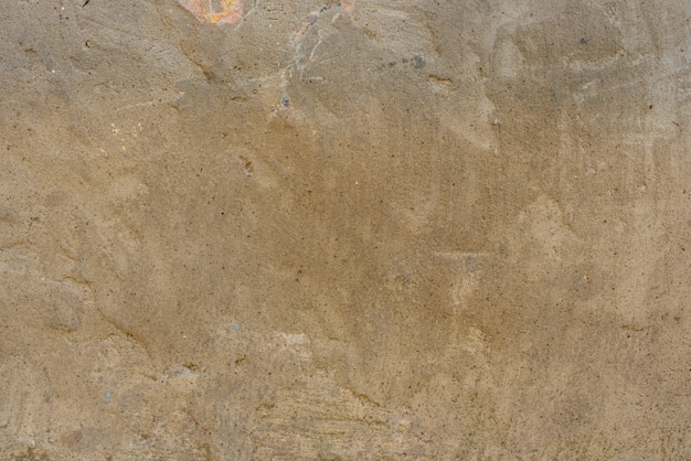 Wall fragment with scratches and cracks