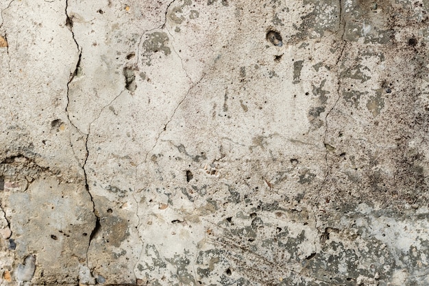 Wall fragment with scratches and cracks