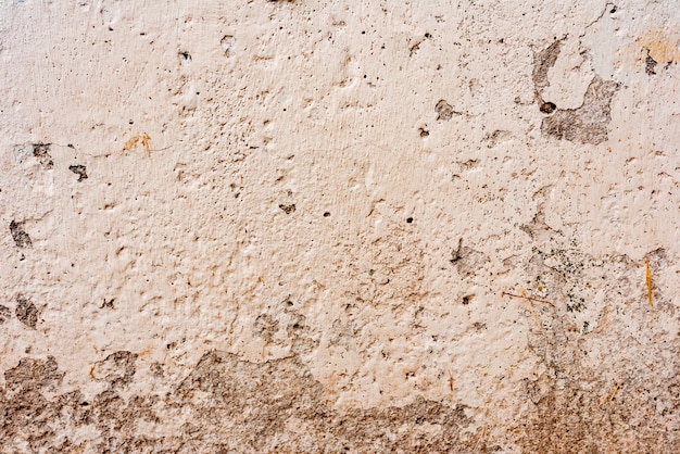 Wall fragment with scratches and cracks