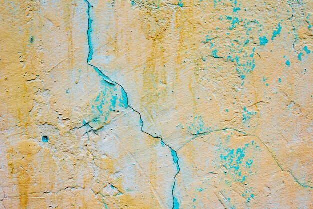 Wall fragment with scratches and cracks