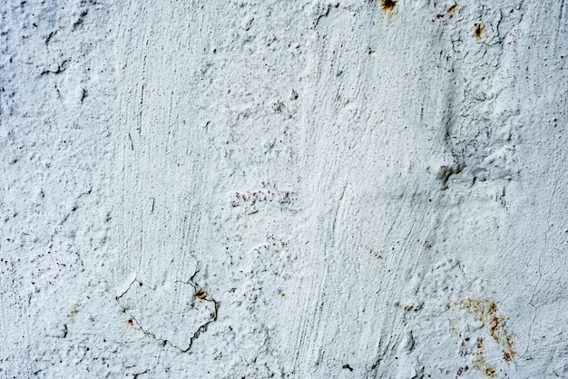 Wall fragment with scratches and cracks