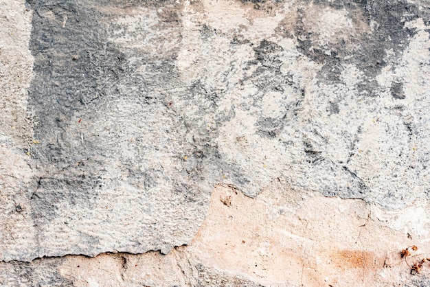 Wall fragment with scratches and cracks