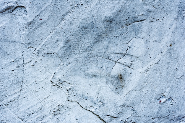 Wall fragment with scratches and cracks