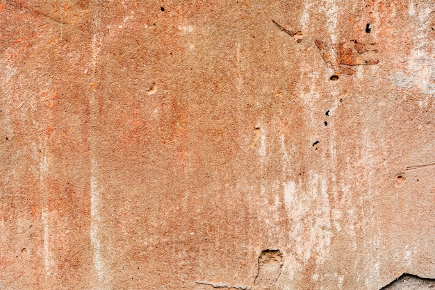 Wall fragment with scratches and cracks