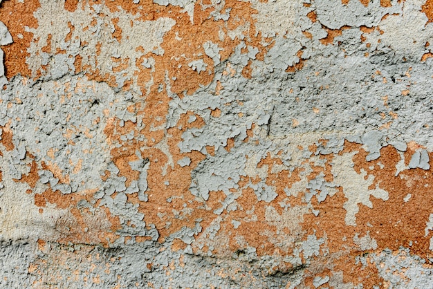 Wall fragment with scratches and cracks