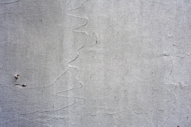 Wall fragment with scratches and cracks