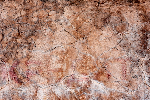 Wall fragment with scratches and cracks