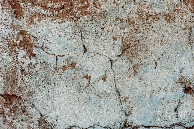 Wall fragment with scratches and cracks