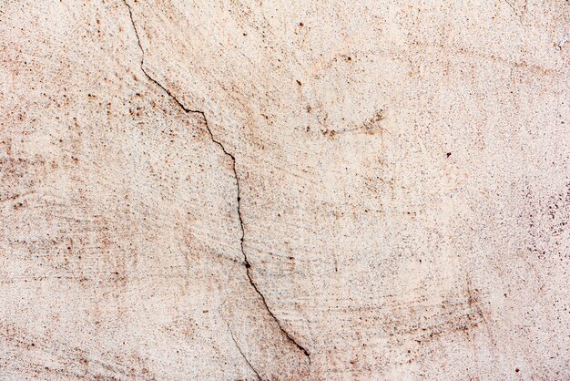 Wall fragment with scratches and cracks