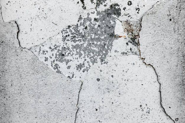 Wall fragment with scratches and cracks