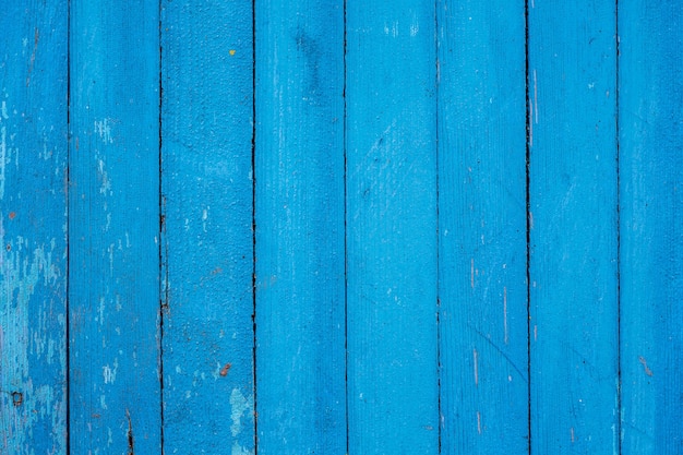 Стена из старых синих досок с потертой краской - фон или текстура