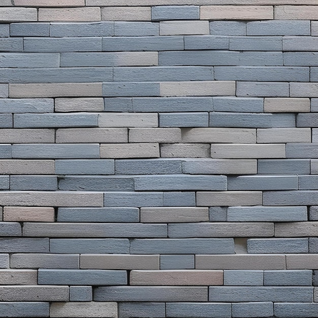 A wall of gray and blue bricks in a street in bangkok.