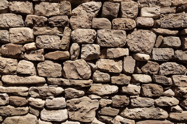 Wall made from stones ancient architecture to protect the house