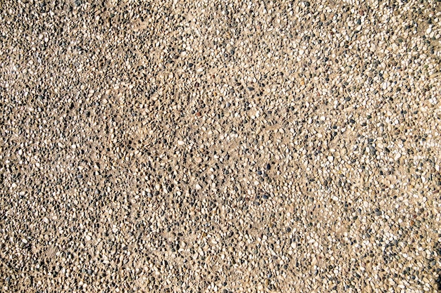 Wall made with small sea pebbles stones as a background