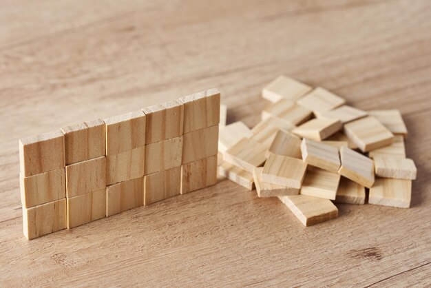 Photo wall made of wooden blocks on wood table finishing task concept