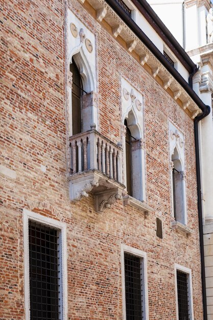 Wall of medieval palazzo on street contra porti