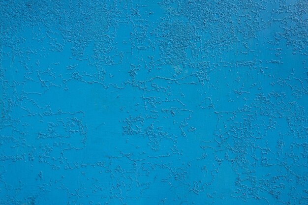 Wall Of An Old Village House Painted With Blue Paint, Which Cracked Over Time Due To Bad Weather