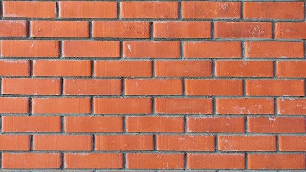 Wall of red bricks close up