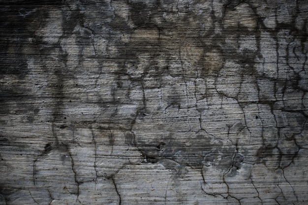 A wall with a lot of textured gray and black paint.