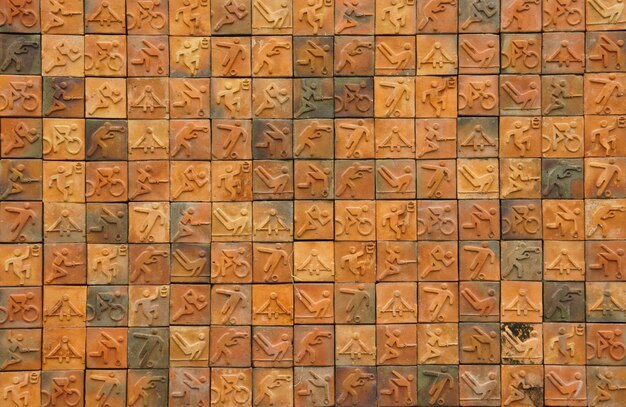 a wall with orange squares with the numbers 75 and 75 on it