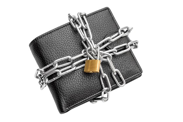 Wallet crossed by metal chain with padlock on white background Protection money concept Top view