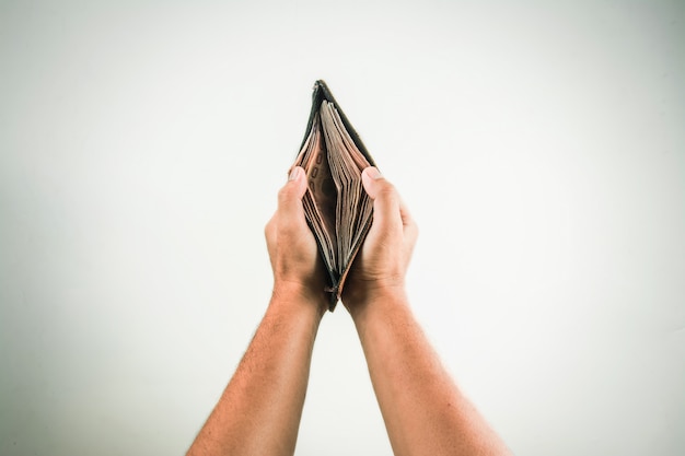 Wallet in hand on white background