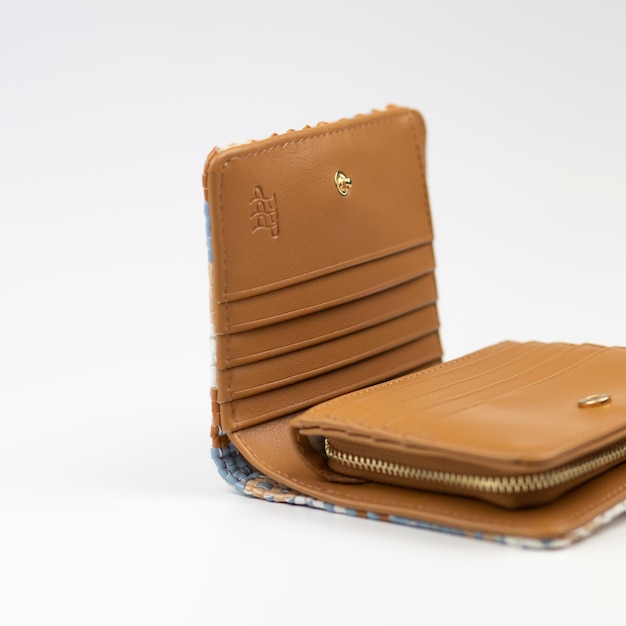 wallet for money in beige color on a white background, leather texture