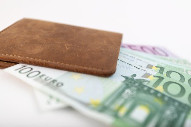 Wallet with euro sticking out of it