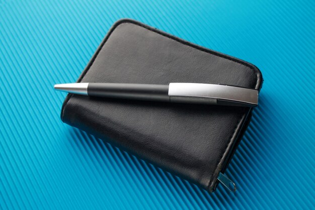 Wallet with pen.