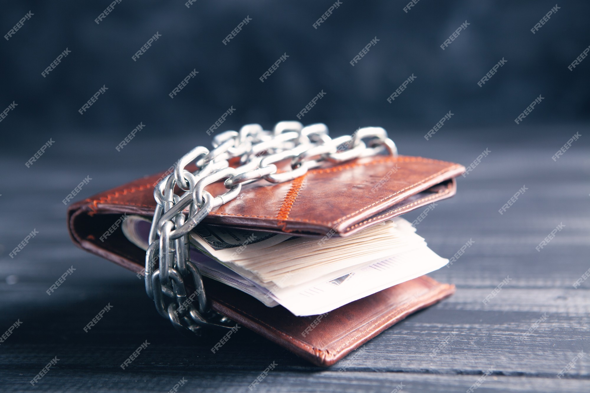 Premium Photo  Wallet wrapped in a chain